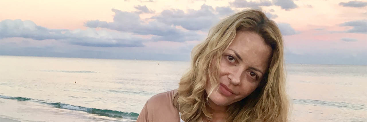 'Prozac Nation' Author Elizabeth Wurtzel Dies at 52 Elizabeth Wurtzel sits at a beach with her dog