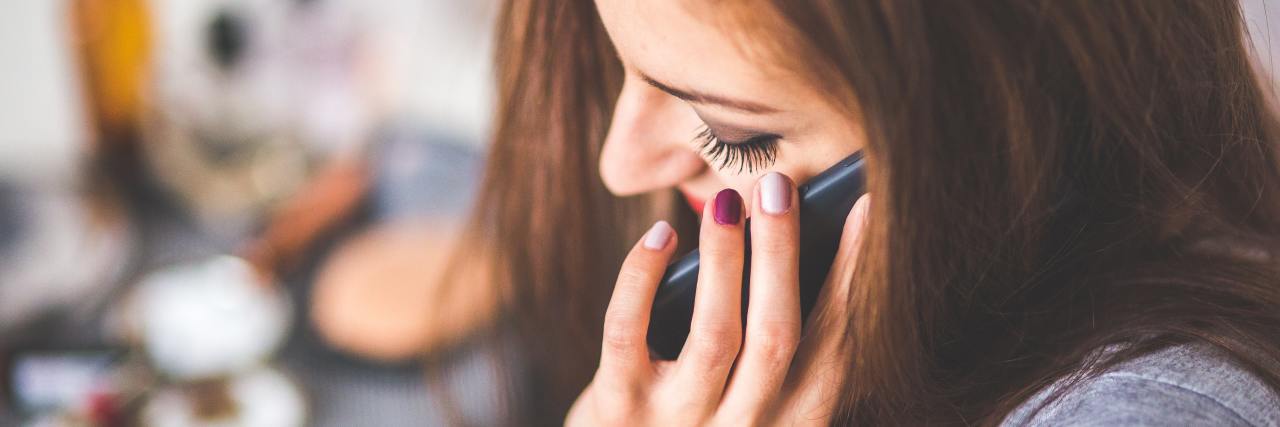Beginning Therapy for Anxiety During the COVID-19 Pandemic photo of woman talking on phone