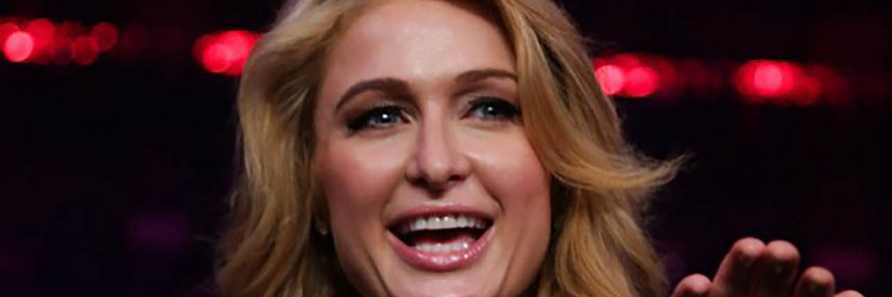 Paris Hilton Felt Suicidal After the Release of Her 2004 Sex Tape Paris Hilton poses in front of a crowd in a black outfit