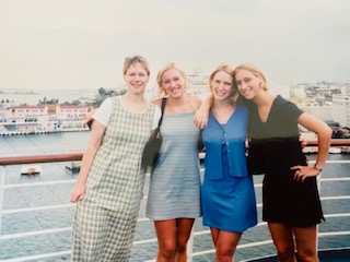 4 women on the deck of a ship