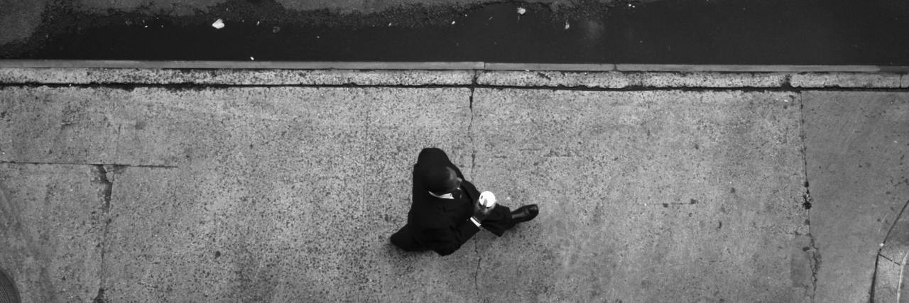 How Small Mindfulness Moments Can Help With Depression black and white aerial photo of man walking on street