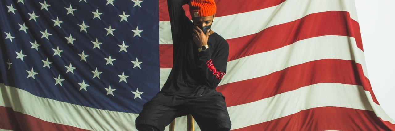 Affirmations for Hope During the Coronavirus Pandemic photo of man wearing face mask in front of American flag