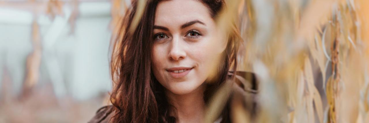 How a Stranger's Moment of Kindness Helped Me During COVID-19 photo of young woman looking into camera with a slight smile