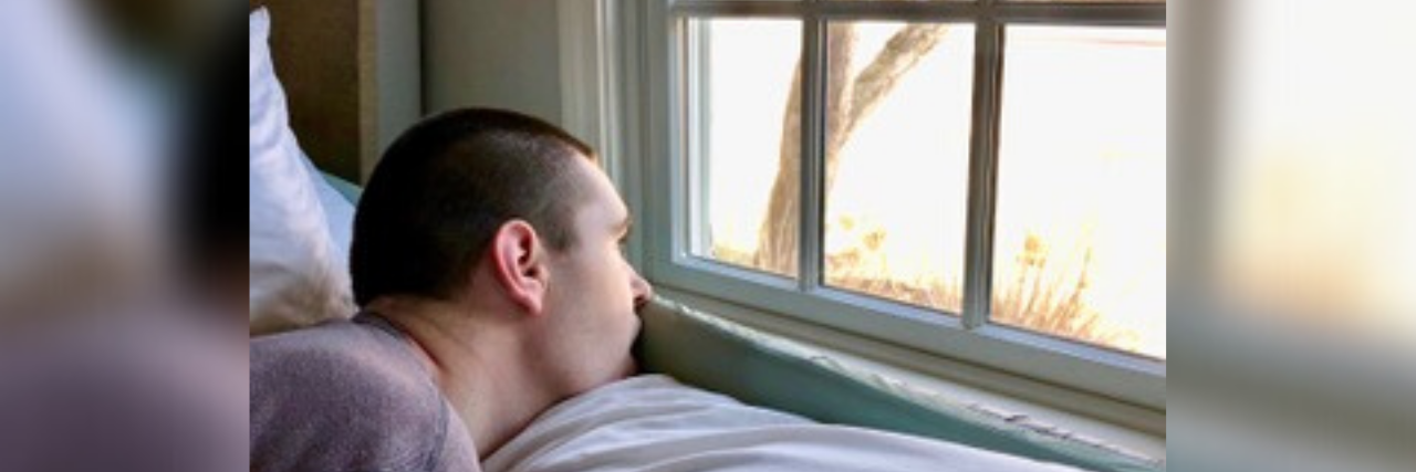 Living With Uncertainty When Parenting a Medically Complex Child Young many looking out a window