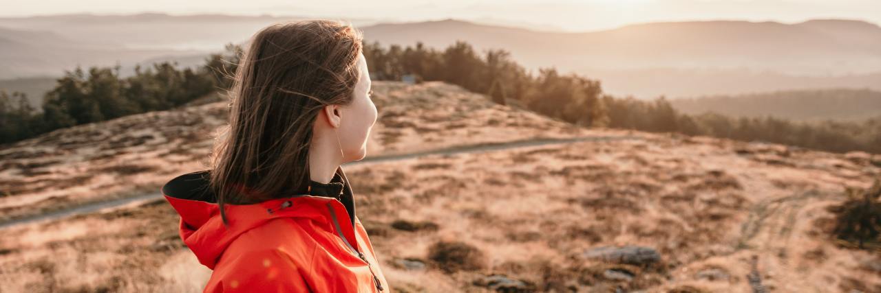 How to Improve Relationships After the Coronavirus Pandemic photo of young woman on hills at sunset, looking into the horizon