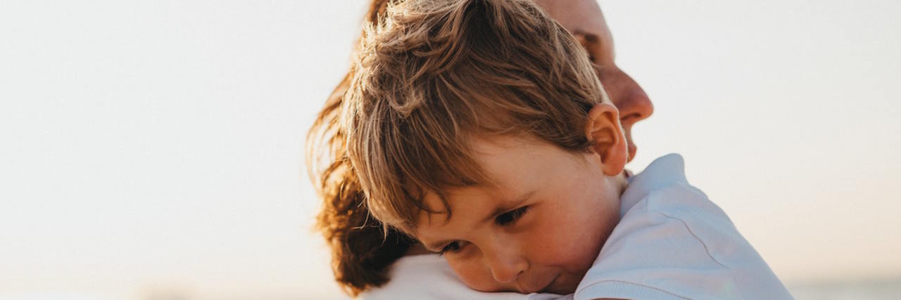 Helping Kids With Anxiety During the Coronavirus Pandemic Mother holding small child, who is hugging her