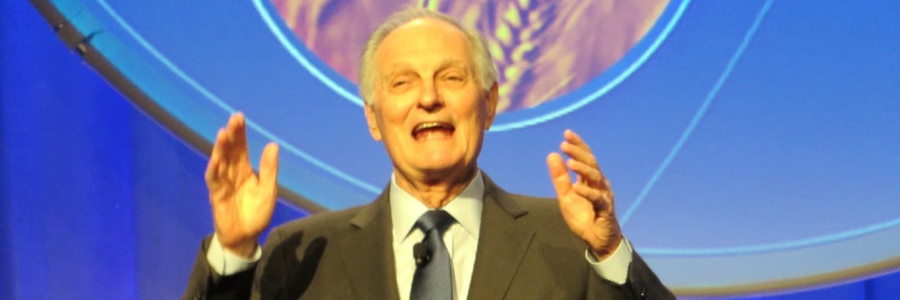 'M*A*S*H' Actor Alan Alda Opens Up About Parkinson's Disease Actor Alan Alda, an older white man with gray hair wearing a dark suit onstage