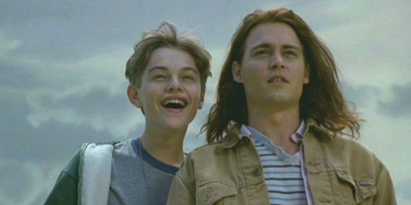 Brothers from the movie What's Eating Gilbert Grape laugh outside