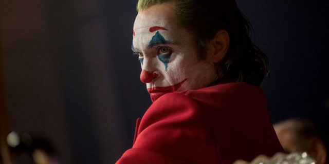 The Joker from the movie Joker in his clown makeup
