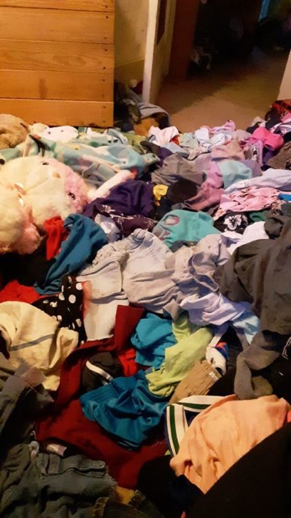 A pile of colorful clothes on the floor
