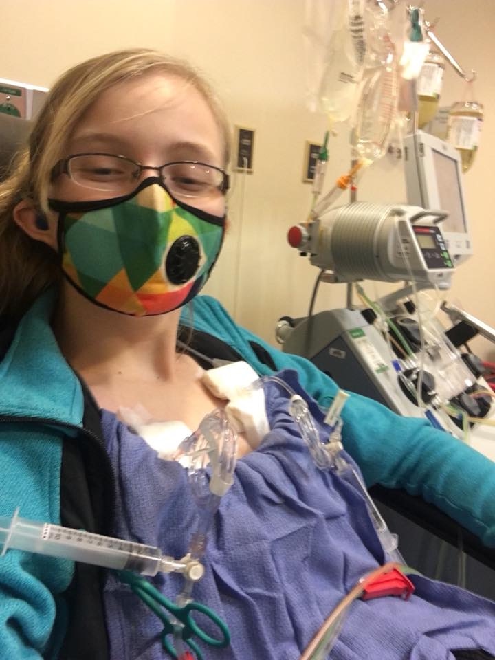 Meghan wearing a mask in the hospital.