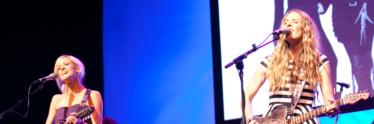 What The Dixie Chicks' 'Gaslighter' Got Right and Wrong About Abuse The Dixie Chicks singing onstage at a concert with guitars