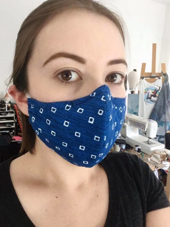 woman wearing a blue polka dot face mask