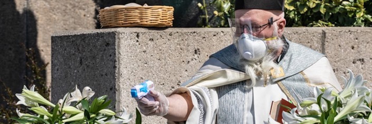 COVID-19: 5 Creative Ways Establishments Are Physical Distancing Father Tim squirts water at car with water gun at St. Ambrose Parish