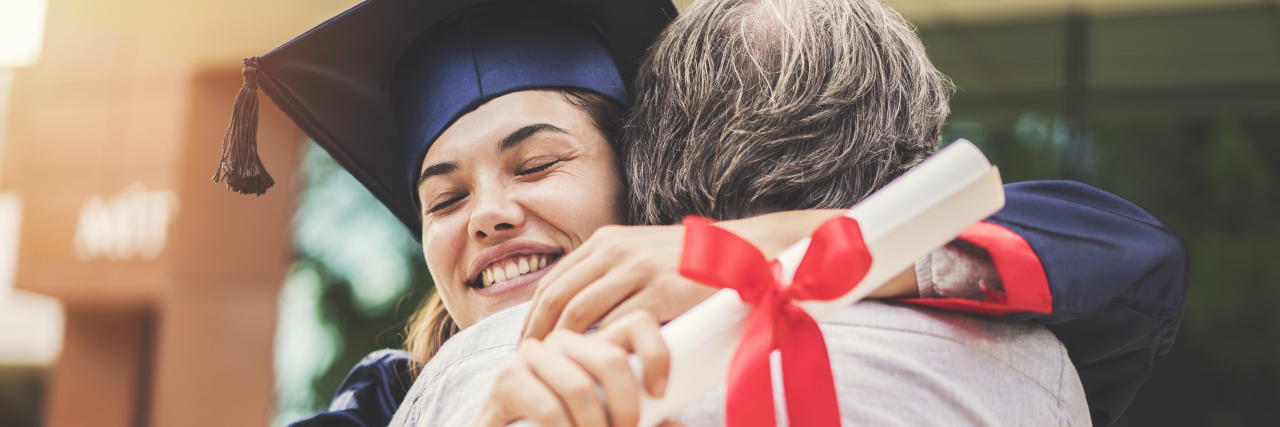 A Letter to the Parents of Graduates With Disabilities a graduate hugging her father