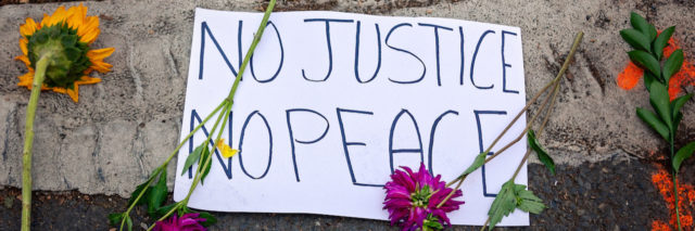Sign that says, no justice, no peace