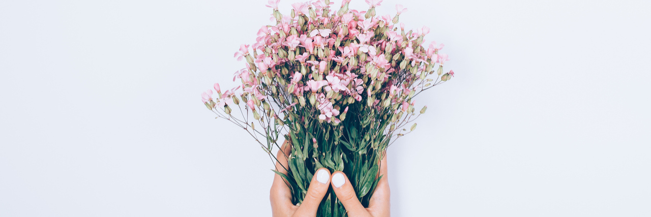 Moving on From My Relationship With My Eating Disorder Top view woman's hands holding bouquet of flowers