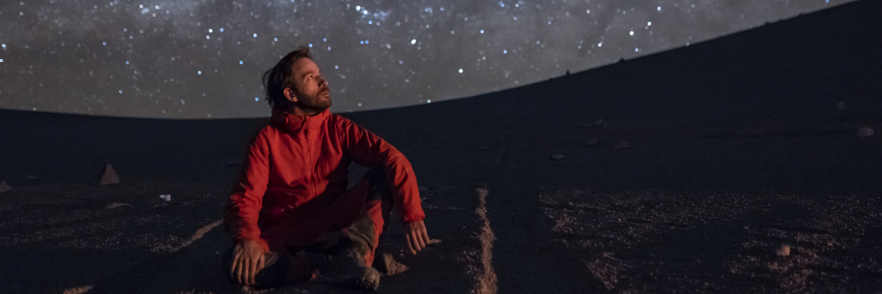 What Being Autistic Feels Like for Me Man in the desert looking at the stars.