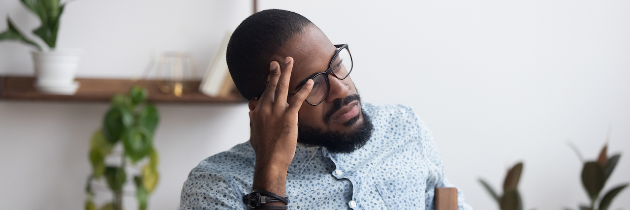 4 Tips for Staying Healthy as a Caregiver Young black man looking thoughtful