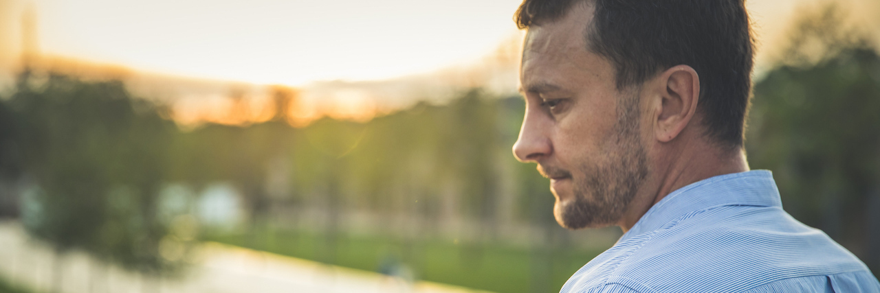 Man With Parkinson's Disease Shares What He Wished People Knew Middle aged man standing in the park