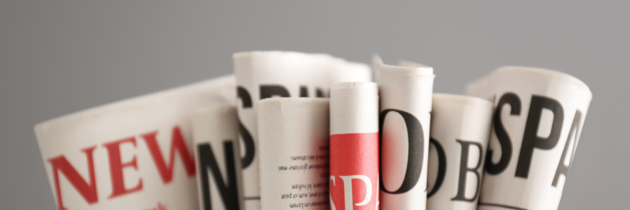Newspapers on grey background
