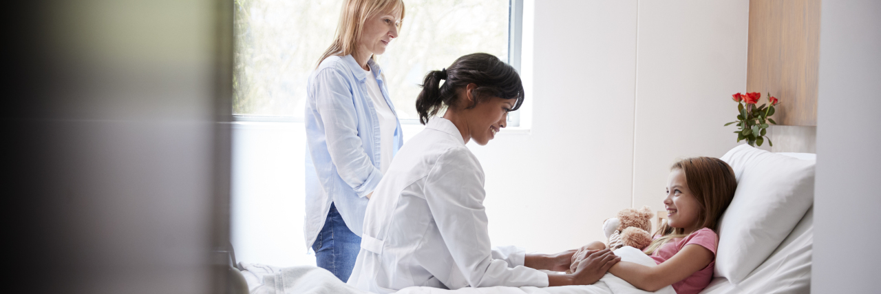 10 Items to Make the Hospital More Comfortable for Your Child Doctor visiting daughter and mother in hospital.