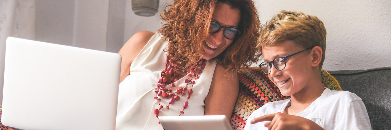 Resources for Parenting a Child With OCD During COVID-19 mother and teenager reading computer and tablet together