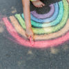 rainbow drawn with chalk on the sidewalk
