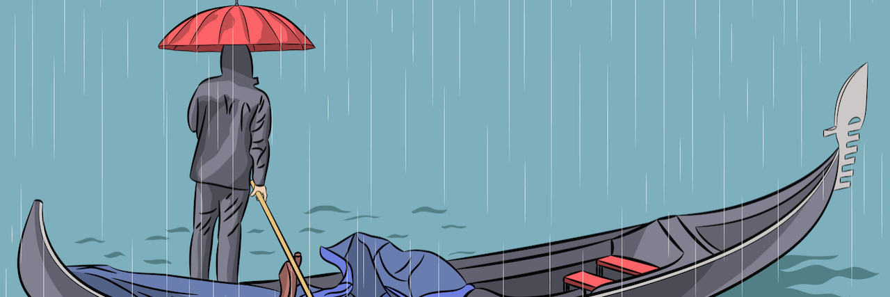 a man on a boat in the rain