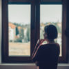 A woman looking out a window