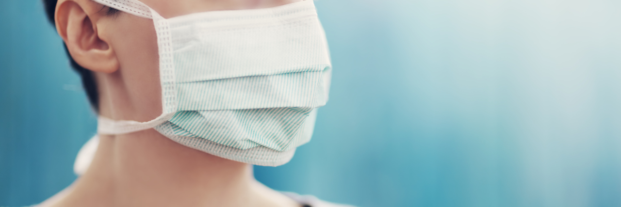 Experiencing Guilt After Receiving a COVID-19 Diagnosis woman wearing mask