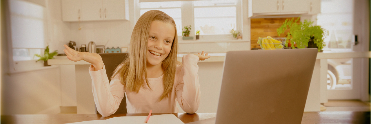 Girl learning online during coronavirus outbreak.