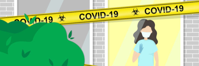 young woman in medical face mask in hospital or home window with COVID-19 caution tape across the outside of her building