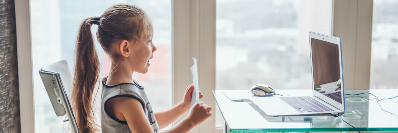 5 Ways to Motivate Kids During COVID-19 Distance Learning Girl doing online schooling. Distance education.