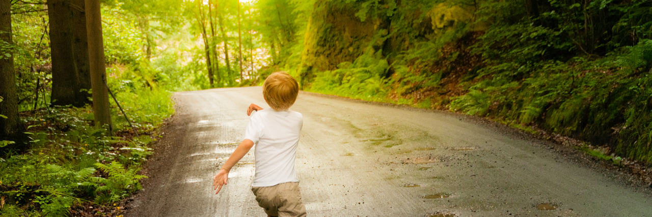 Understanding and Accepting My Nonverbal Autistic Child Boy running in the forest