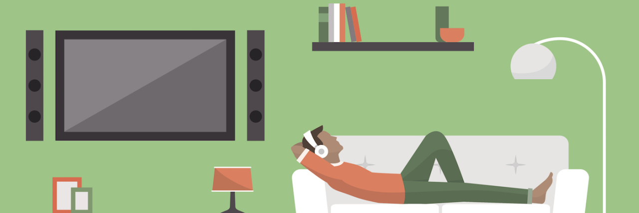 How Music Has Helped Me Survive and Thrive Man relaxing on sofa with headphones on