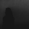 silhouette of woman in the dark