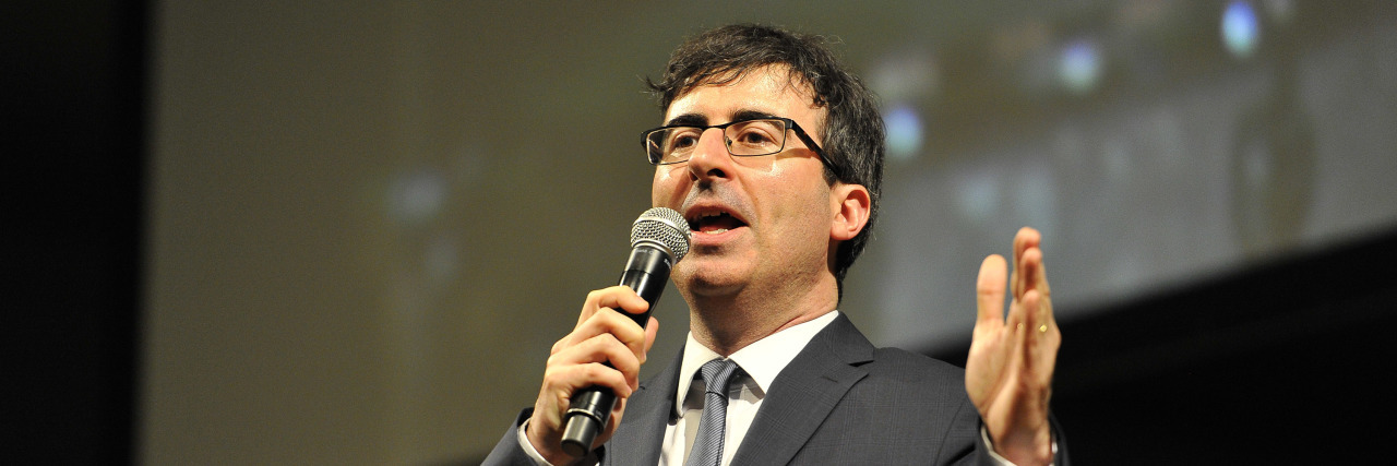 John Oliver’s Analyzes Bias in Medicine on 'Last Week Tonight' John Oliver speaks onstage in suit