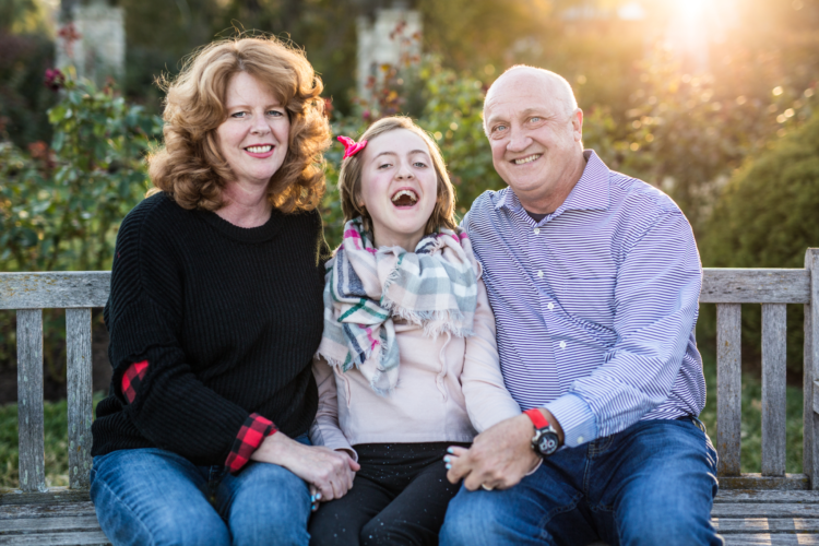 the parents of Elouise and Elouise, sitting and smiling