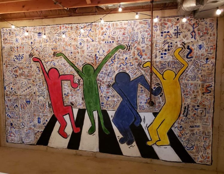 basement wall painting of four people