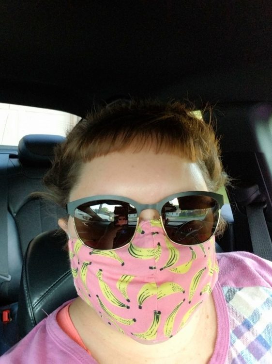 woman wearing a banana face mask