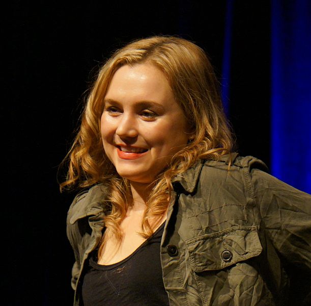 Rachel Miner smiles at the crowd from onstage