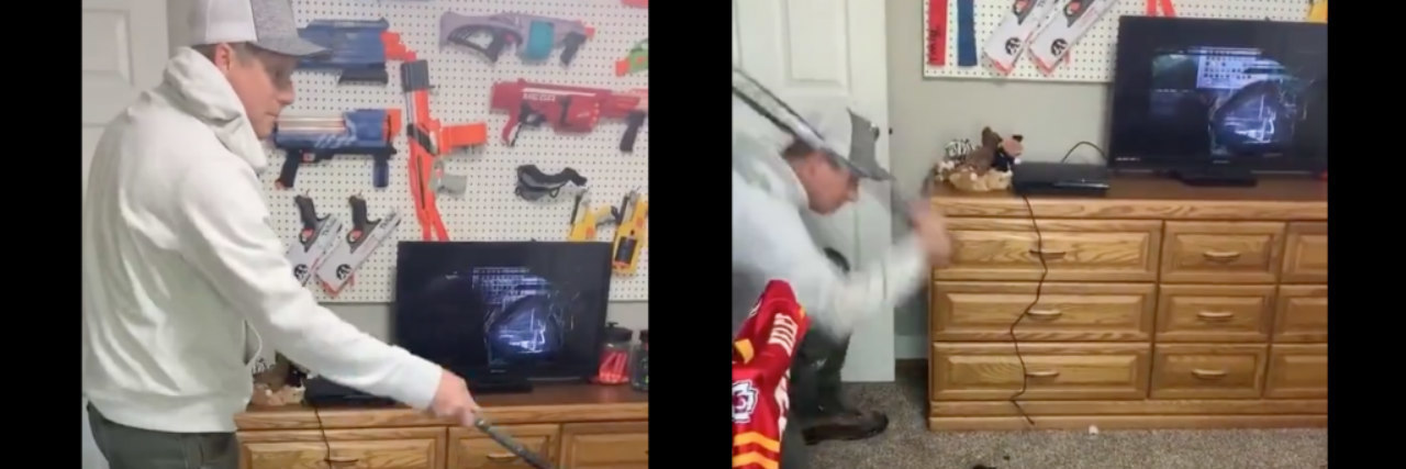 Dad smashing his kids game controllers with a baseball bat