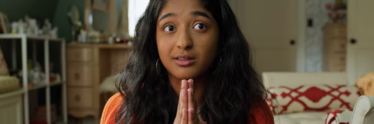 An Indian American Woman Reviews Netflix's 'Never Have I Ever' Devi from "Never Have I Ever" with her hands in a prayer position