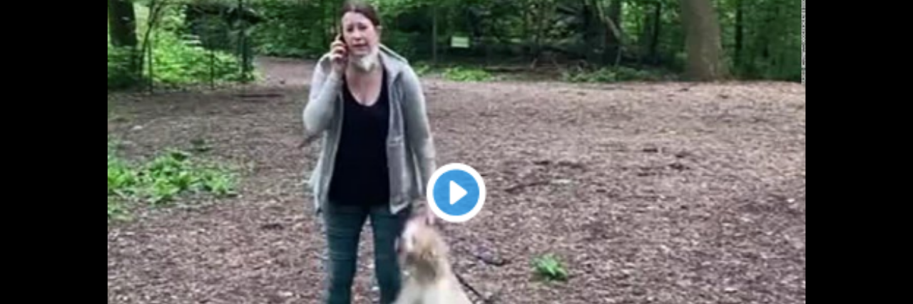 Amy Cooper talking on her phone holding her dog