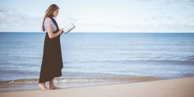 How I Realized My Childhood Fears Were Really OCD photo of woman standing on beach with bible