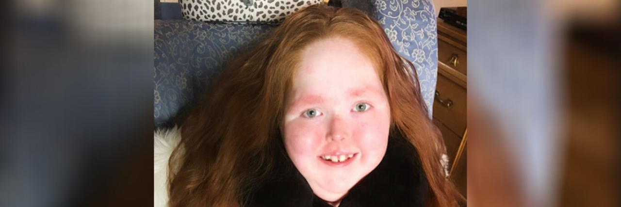 Protecting Children With Disabilities During COVID-19 Chalie-Anne wearing a red shirt that says "Listen to Your Heart."