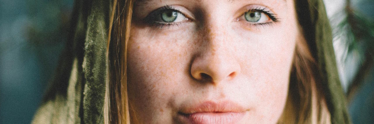 Similarities Between Grieving and COVID-19 Crisis a woman looking serious