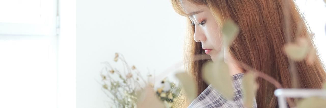 How to Start a Gratitude Journal Routine for Self-Care photo of woman reading or writing
