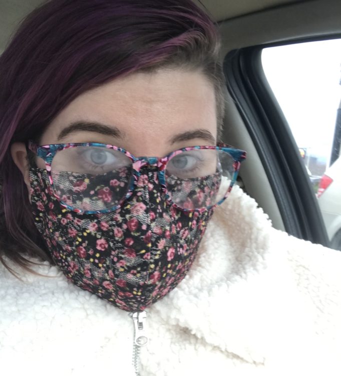 person wearing a flowery face mask